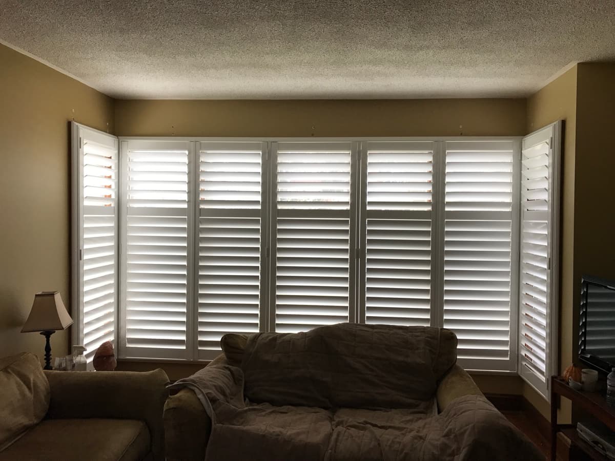 California shutter installation in living room - Canadian Shutters GTA