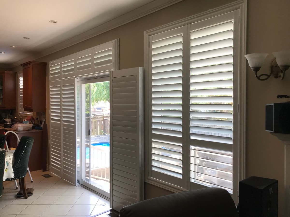Elegant California shutters in bay window - Toronto home