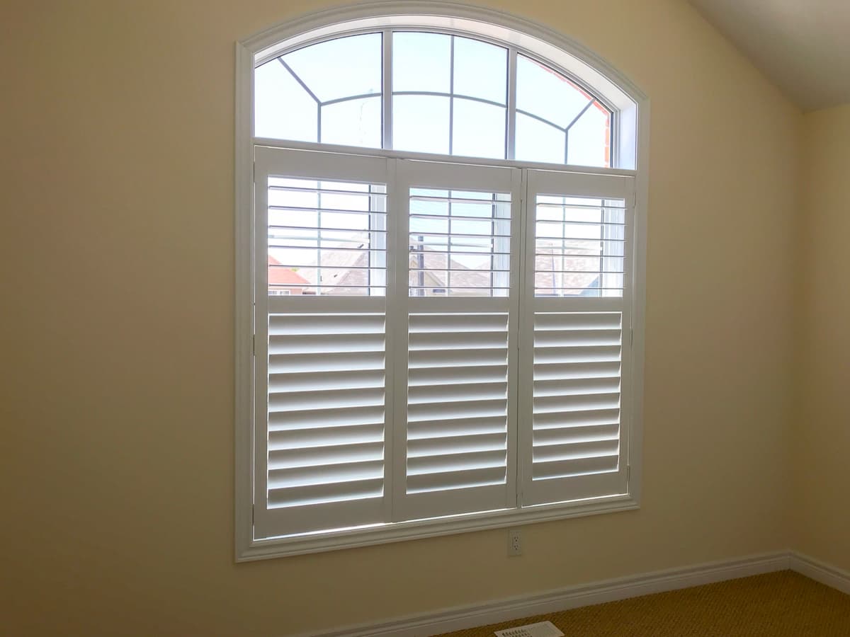 Custom California shutters on arched window - GTA