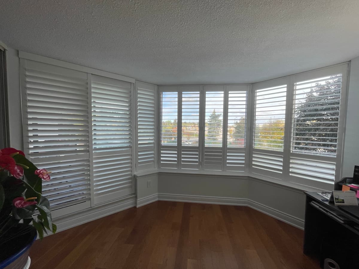 California shutter panels in guest bedroom - Canadian Shutters